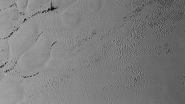 Pluto’s Puzzling Patterns and Pits